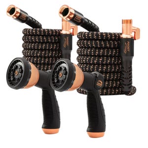 2-pack of 25-foot expandable hoses with copper fittings, featuring black and copper braided design. Includes two black spray nozzles with adjustable settings and ergonomic grips.