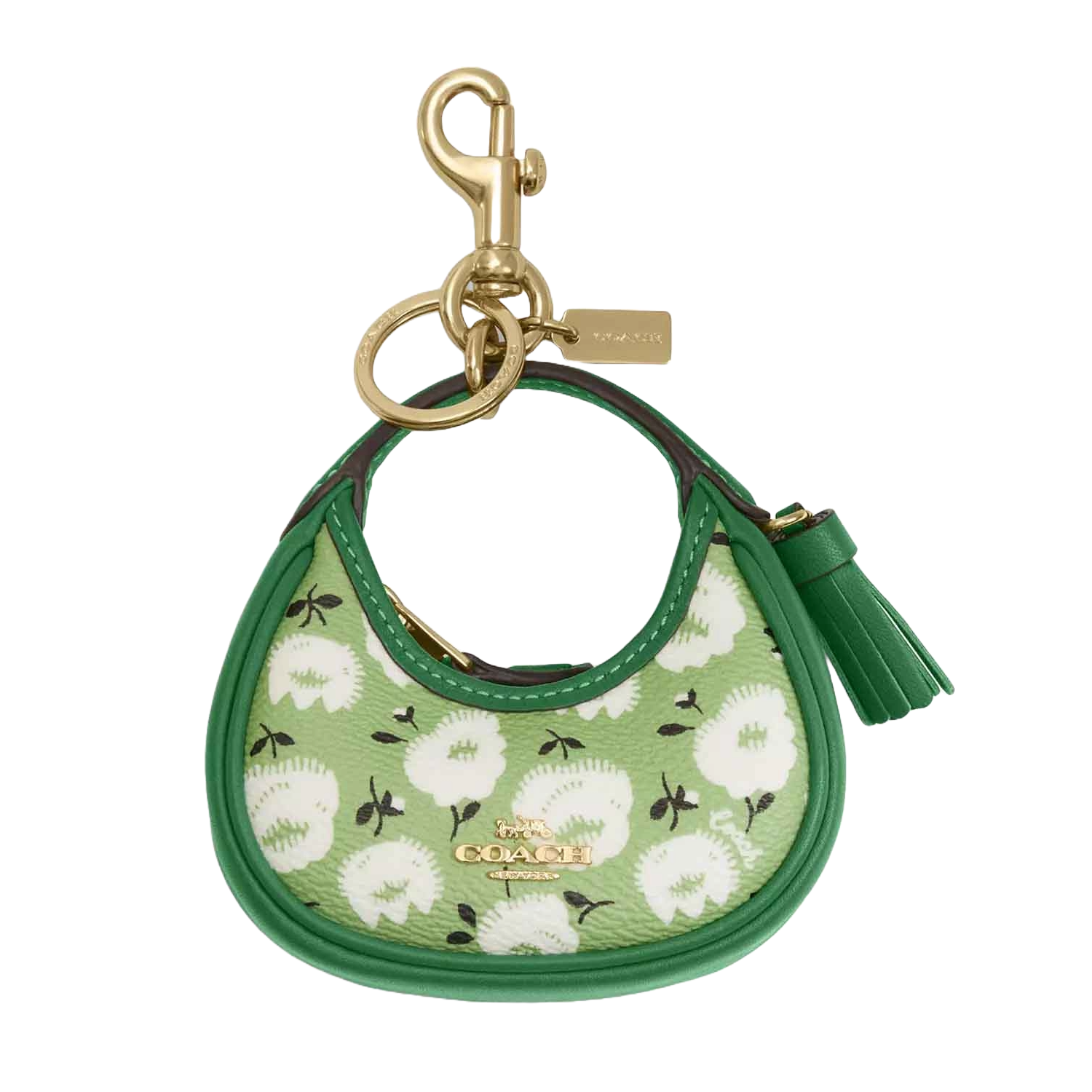 Green Coach handbag keychain featuring a floral pattern with gold-tone hardware and a tassel accent.
