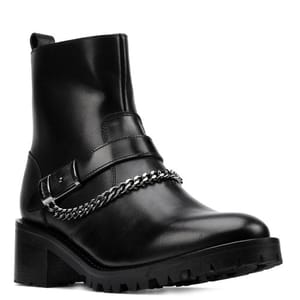 Black ankle boot with a chunky sole, featuring a decorative chain and buckle strap across the front.