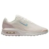 A white Nike sneaker featuring a light blue swoosh, light pink accents, and visible Air Max cushioning.