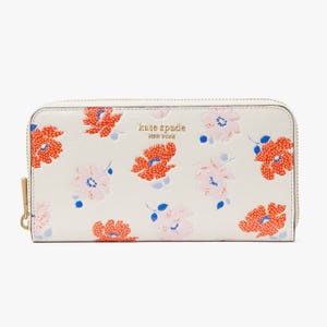 White zip-around wallet with floral print.