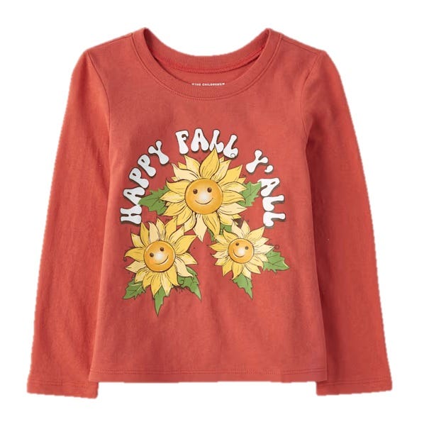 Rust-colored long-sleeve shirt featuring smiling sunflowers and the text \“HAPPY FALL Y'ALL\“ in white letters.