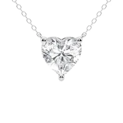 A heart-shaped diamond pendant on a delicate silver chain, featuring a three-prong setting.