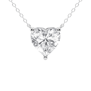 A heart-shaped diamond pendant on a delicate silver chain, featuring a three-prong setting.