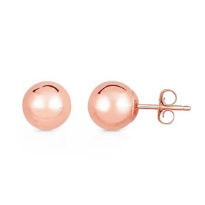 Rose-gold plated silver stud earrings with a smooth, spherical design and secure butterfly backings.