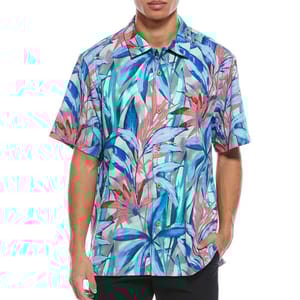 A short-sleeve button-up shirt featuring a vibrant tropical leaf pattern in blue, red, and teal tones.