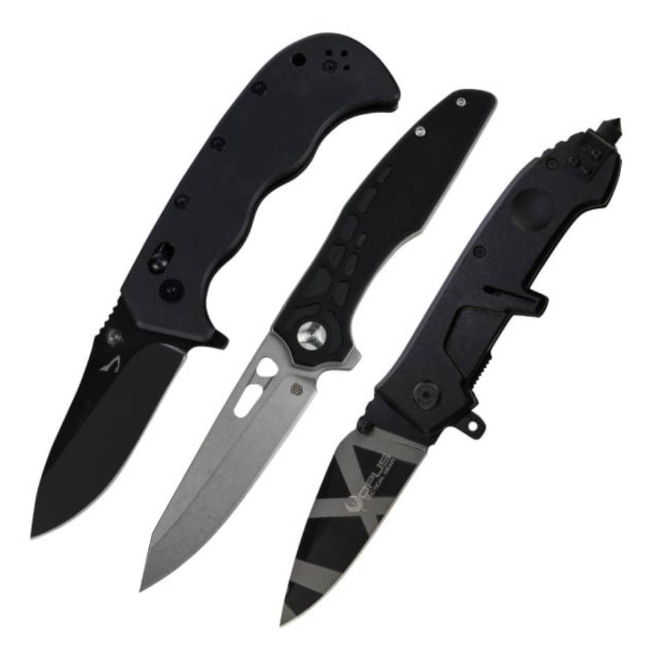 Three folding knives, each with distinct designs: a black-handled knife with a dark blade, a knife with a silver-toned blade featuring a cutout, and a black knife with a black blade featuring grey stripes.