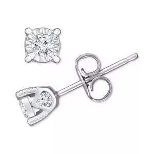 Silver stud earrings with a round diamond in a four-prong setting and one diamond in a heart-shaped outline.