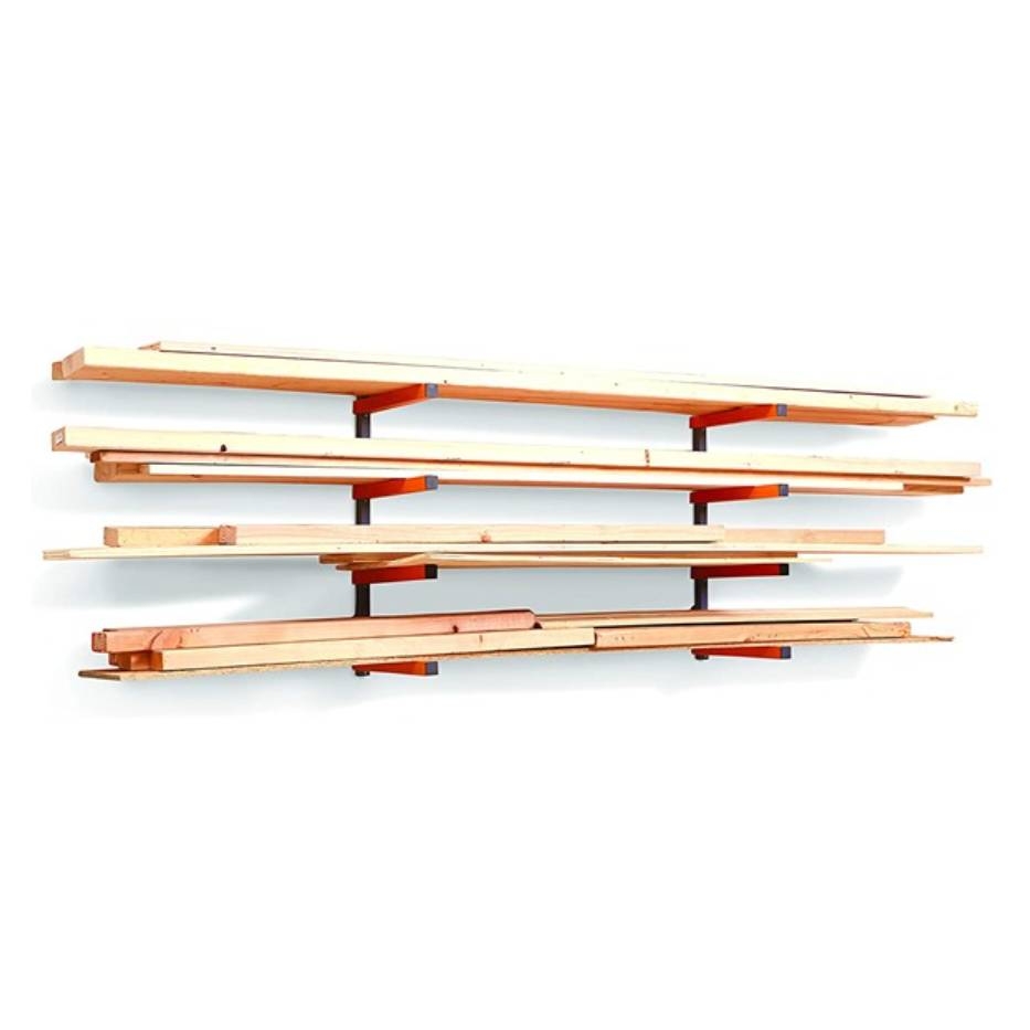 A wall-mounted wood rack system with various lengths of lumber supported horizontally by red brackets.