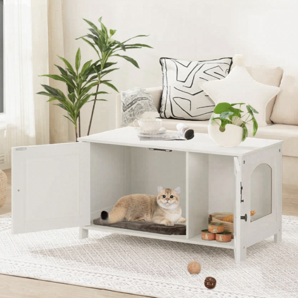 A white multifunctional coffee table featuring a hidden pet compartment housing a cat. The room includes a beige sofa with patterned cushions, a potted plant, and a light rug with various decorative items.