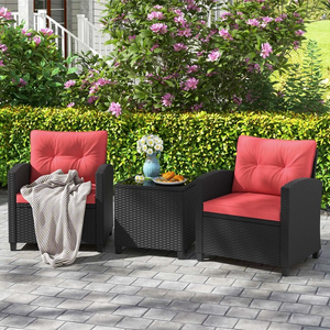 The 3-piece patio conversation set features two black rattan armchairs with red cushions and a matching square side table. The chairs include plush padding, and the set is designed for outdoor use on patios or gardens.