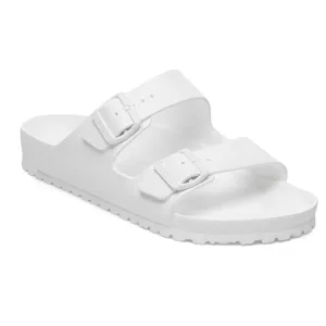 A white slide sandal with two adjustable straps and buckles, featuring a textured sole for grip.