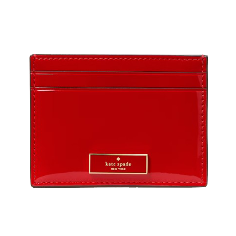 Red Kate Spade New York cardholder with a glossy finish and multiple card slots.