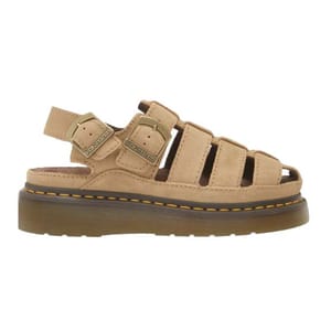 A beige sandal with a chunky sole, featuring multiple straps and adjustable buckles, displaying the Dr. Martens logo on the fastening.