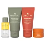 Origins skincare set includes Checks and Balances frothy face wash, Youthtopia peptide plumping apple cream, Checks and Balances milky oil cleanser, and GinZing brightening eye cream.