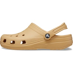 Tan Crocs Classic Clogs with ventilation ports, a pivoting heel strap, and a round toe. Made of durable, lightweight foam material for comfort and easy cleaning.