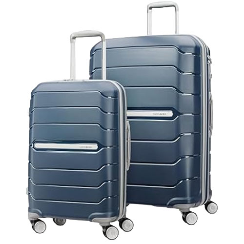Two blue hard-shell suitcases with telescopic handles and four double wheels, designed for easy maneuverability and durability.