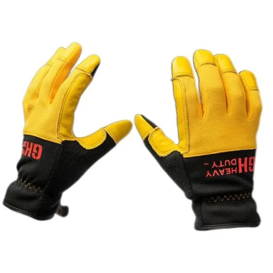 A pair of heavy-duty work gloves with yellow backs, black wrist cuffs, and the word \“SHIELD\“ in red on the wrist.