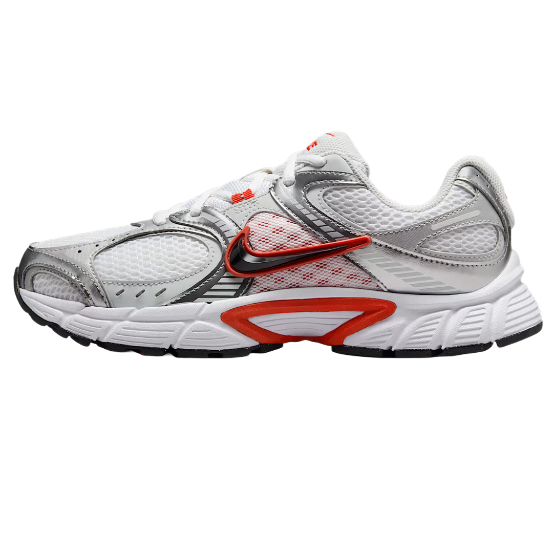 Nike Zoom Vomero 5 sneaker in white, gray, and red with a distinctive black swoosh and mesh panels.