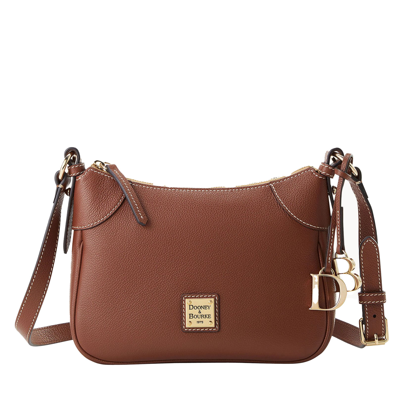 A brown Dooney & Bourke leather crossbody bag with gold hardware, featuring a central plaque with the brand logo, adjustable strap, and decorative gold letter charms.