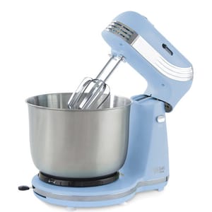 A blue electric stand mixer with a stainless steel mixing bowl and dual beaters.