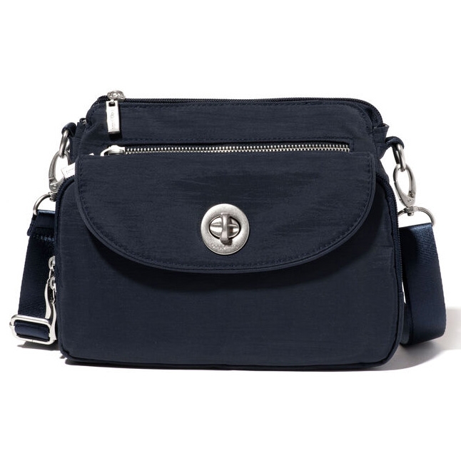 Navy blue shoulder bag with front flap, zipper compartment, and adjustable strap.