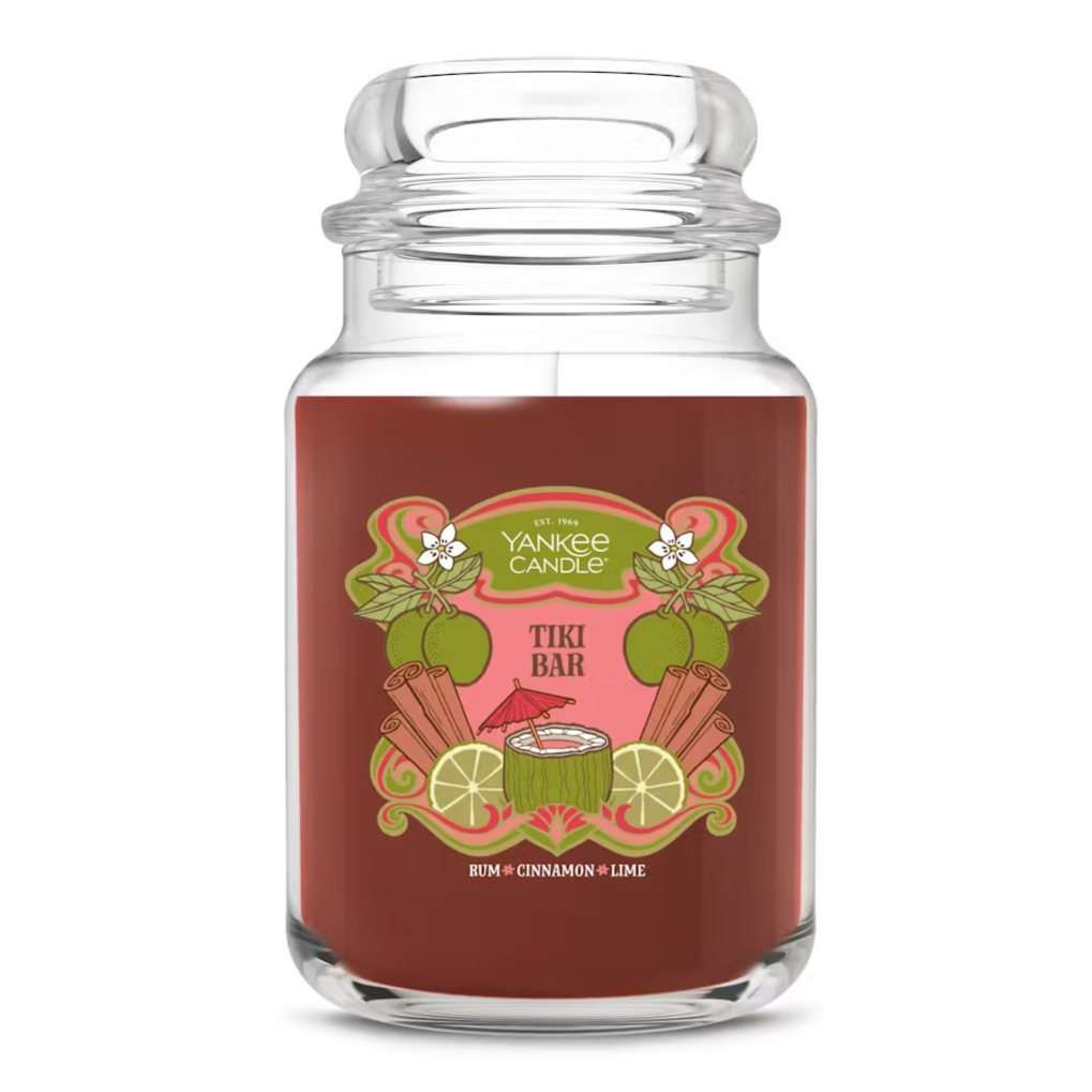 Yankee Candle Tiki Bar scented candle featuring notes of rum, cinnamon, and lime in a decorative jar.