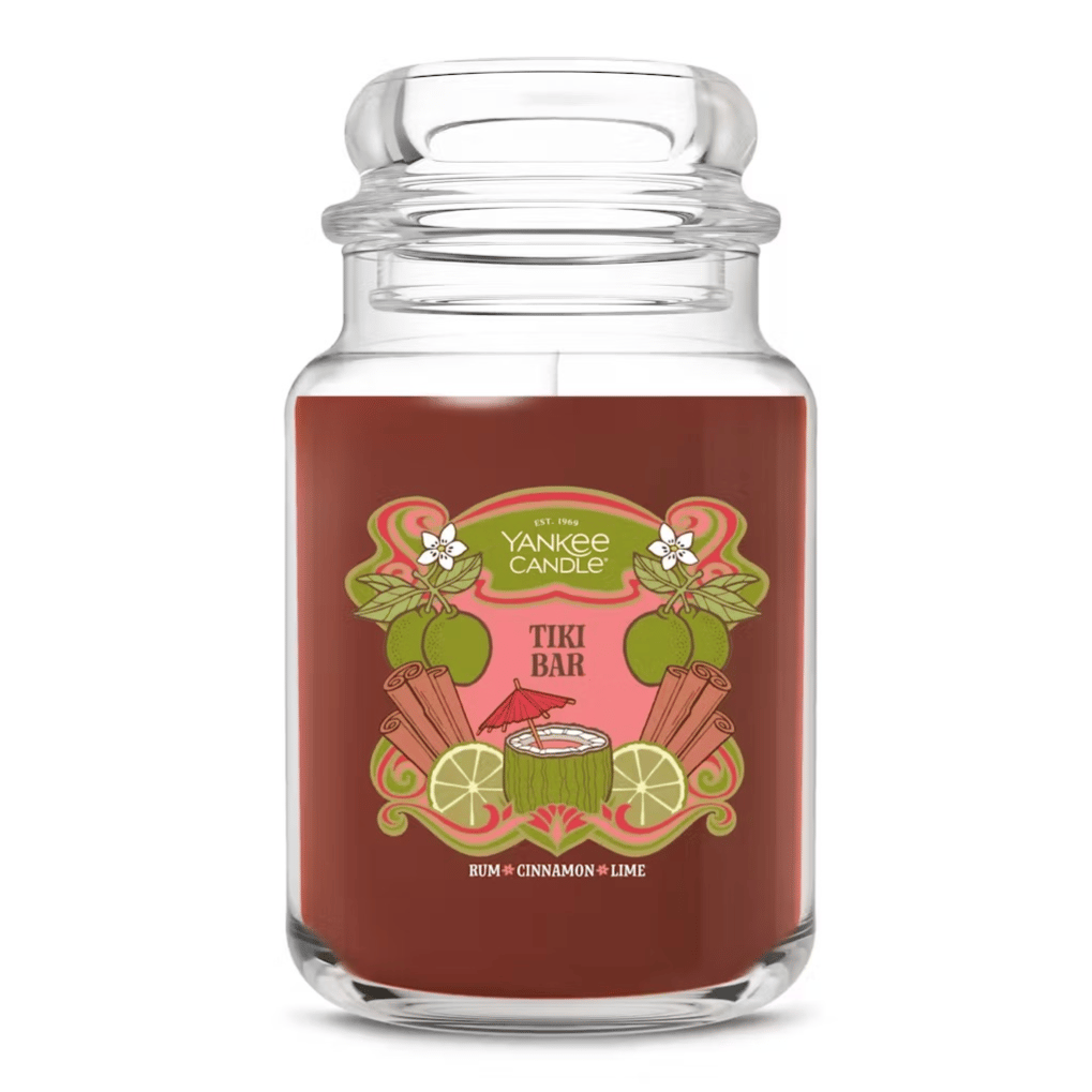 Yankee Candle Tiki Bar scented candle featuring notes of rum, cinnamon, and lime in a decorative jar.