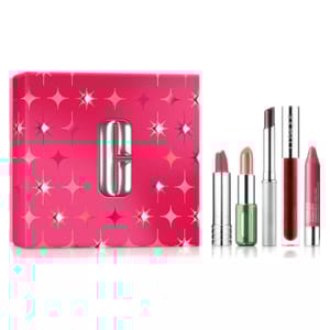 A Clinique gift set featuring four lip products in various shades: two lipsticks, a chubby lip balm, and a high-shine gloss, alongside a pink box decorated with silver stars.