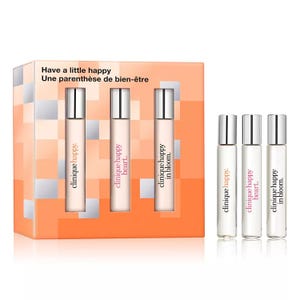 Set of Clinique fragrances includes three travel-sized perfumes: Clinique Happy, Clinique Happy Heart, and Clinique Happy in Bloom, packaged together in an orange box.