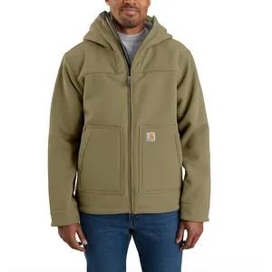 A person is wearing an olive hooded jacket with a front zipper and two pockets, featuring a Carhartt logo, paired with blue jeans.