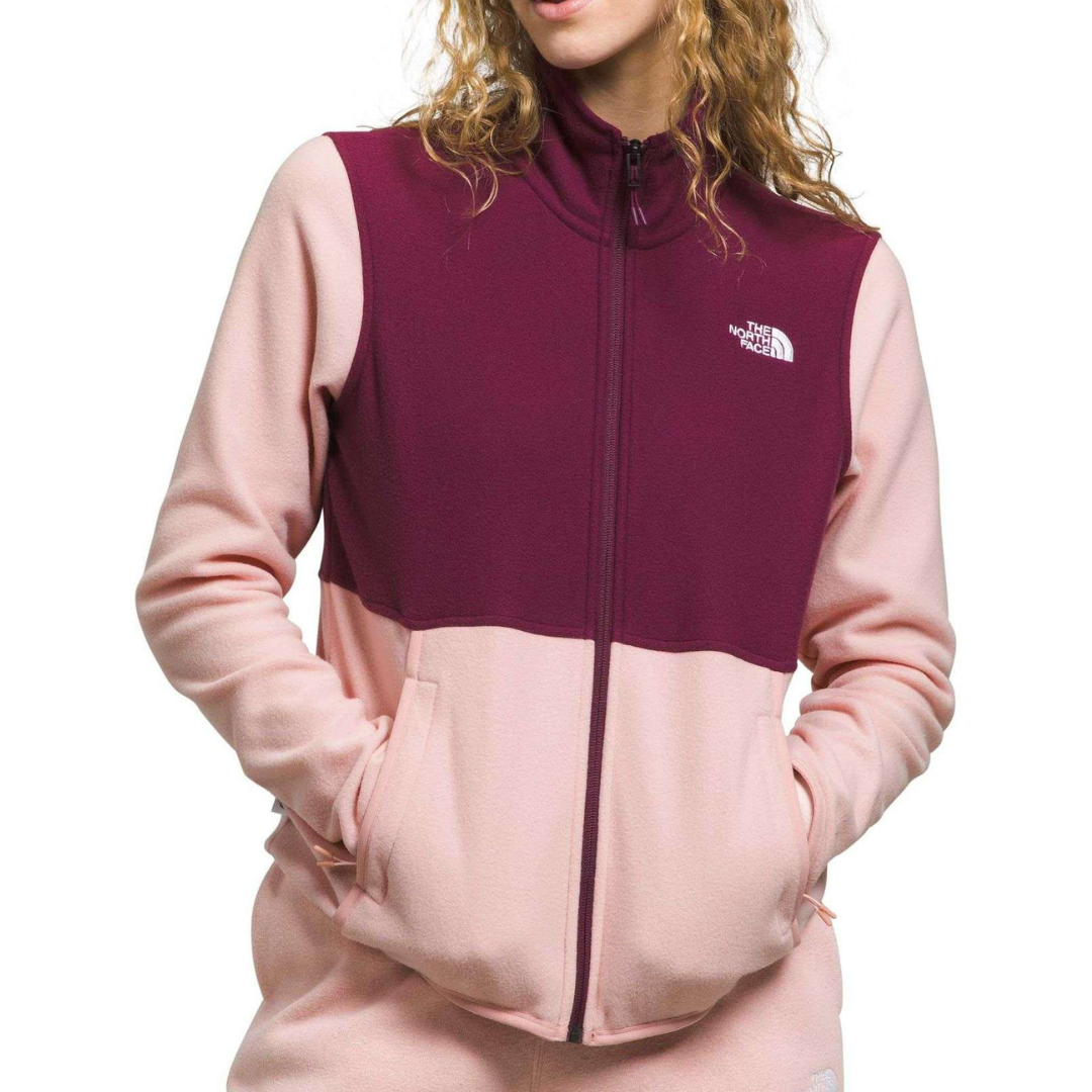 Color-blocked fleece jacket with a full zip, featuring burgundy and pink hues. The North Face logo is visible on the upper right chest.