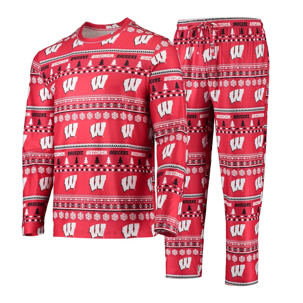 The Wisconsin Holiday Sleep Set features a red long-sleeve top and pants with festive patterns including white \“W\“ logos, snowflakes, trees, and the words \“Badgers\“ and \“Wisconsin\“ in rows.