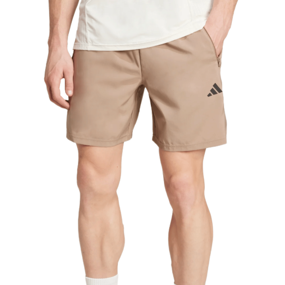 Tan athletic shorts with side pockets and a black Adidas logo on the left leg.