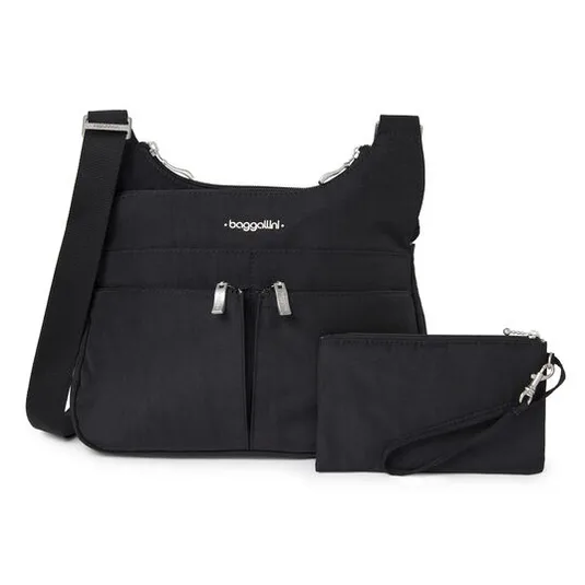 A black Baggallini crossbody bag with dual front zippers, adjustable strap, and matching wristlet pouch. The design is simple and functional, suitable for everyday use.