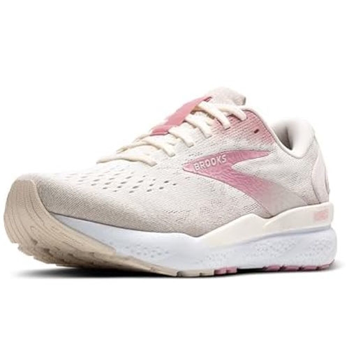 A light pink and beige running shoe with a cushioned sole and lace-up design. Features include breathable material and a logo on the side.