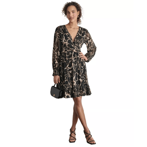 A woman wearing a black floral print dress with long sleeves, strappy black sandals, and carrying a small black shoulder bag.
