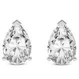 A pair of pear-shaped diamond stud earrings set in white metal, each secured with a three-prong setting.