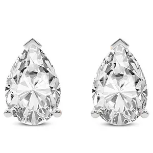 A pair of pear-shaped diamond stud earrings set in white metal, each secured with a three-prong setting.