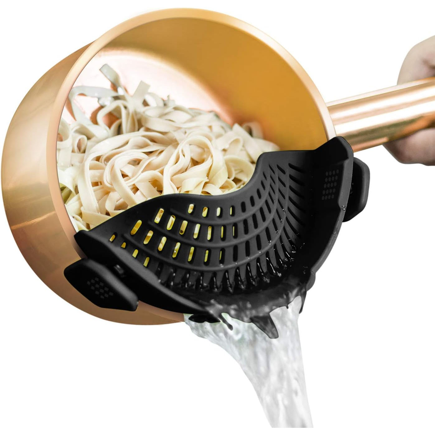 A black clip-on pot strainer is attached to a copper pot, draining water from cooked noodles.