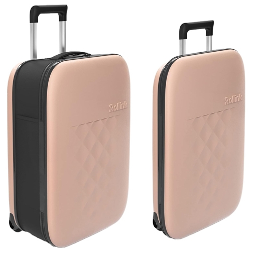 The 21\“ collapsible carry-on is a sleek, light pink suitcase featuring a quilted pattern and dual black handles with retractable wheels. Its compact design allows for easy storage.