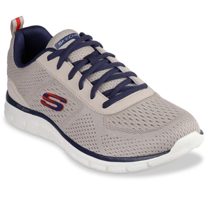 A lightweight beige and navy mesh sneaker with a red accent \“S\“ logo, designed by Skechers, featuring dark blue laces and a cushioned white sole for comfort.
