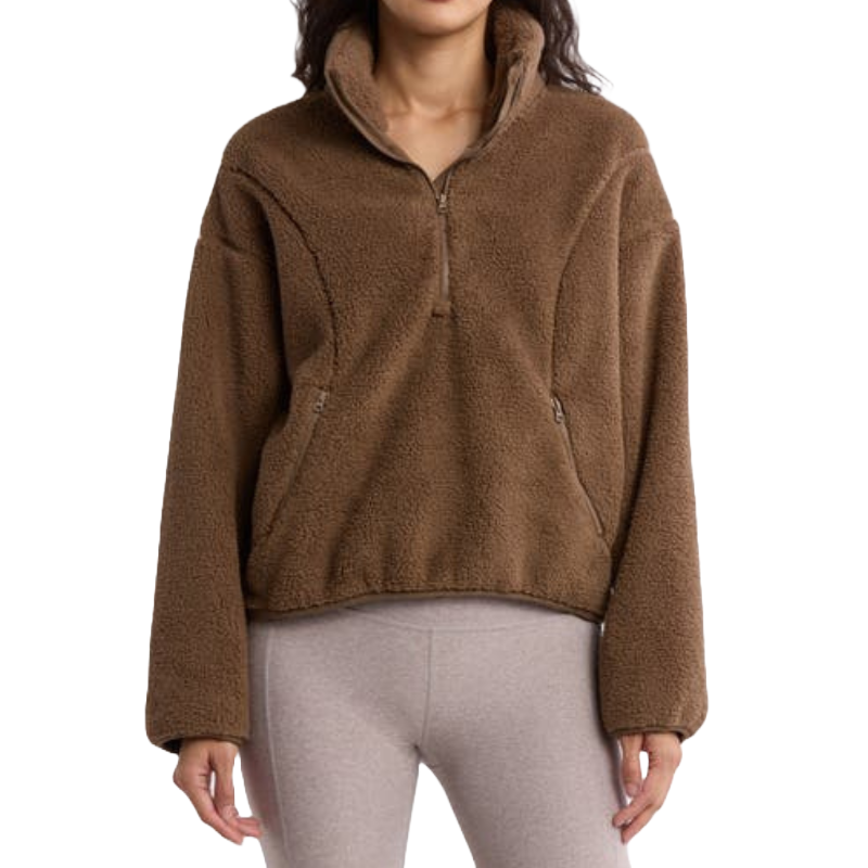Brown half-zip pullover with a high collar and plush, fleece texture. Features a relaxed fit and zippered pockets for convenience.