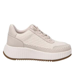 A beige lace-up sneaker with a textured upper and a thick, ribbed white sole for added height.