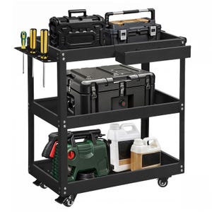 A black rolling utility cart with three shelves holds toolboxes, a set of screwdrivers, a power tool, and plastic jugs, equipped with swivel caster wheels for mobility.