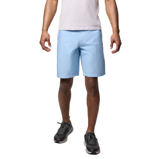 A person is wearing light blue shorts, a light-colored T-shirt, and black sneakers.