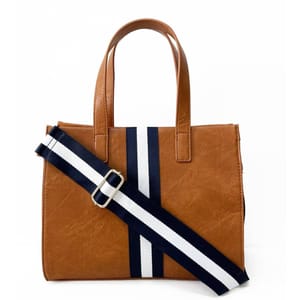 A brown 12\“ tote bag features dual handles and a detachable navy and white striped shoulder strap for versatile carrying.