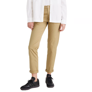Dockers Weekend Chinos are beige, slim-fit trousers with a cuffed hem, worn with a white shirt and black sneakers. They offer a casual yet polished look suitable for weekend outings.