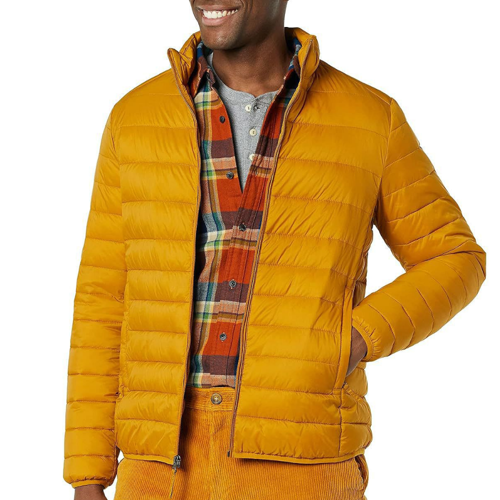 Yellow puffer jacket paired with a plaid shirt and mustard corduroy pants.