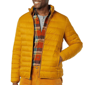 Yellow puffer jacket paired with a plaid shirt and mustard corduroy pants.